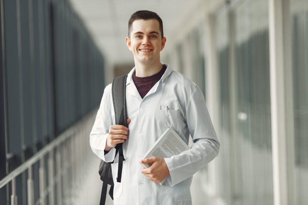Male vet student studying, preparing for a successful career in veterinary medicine with essential vet student tips.