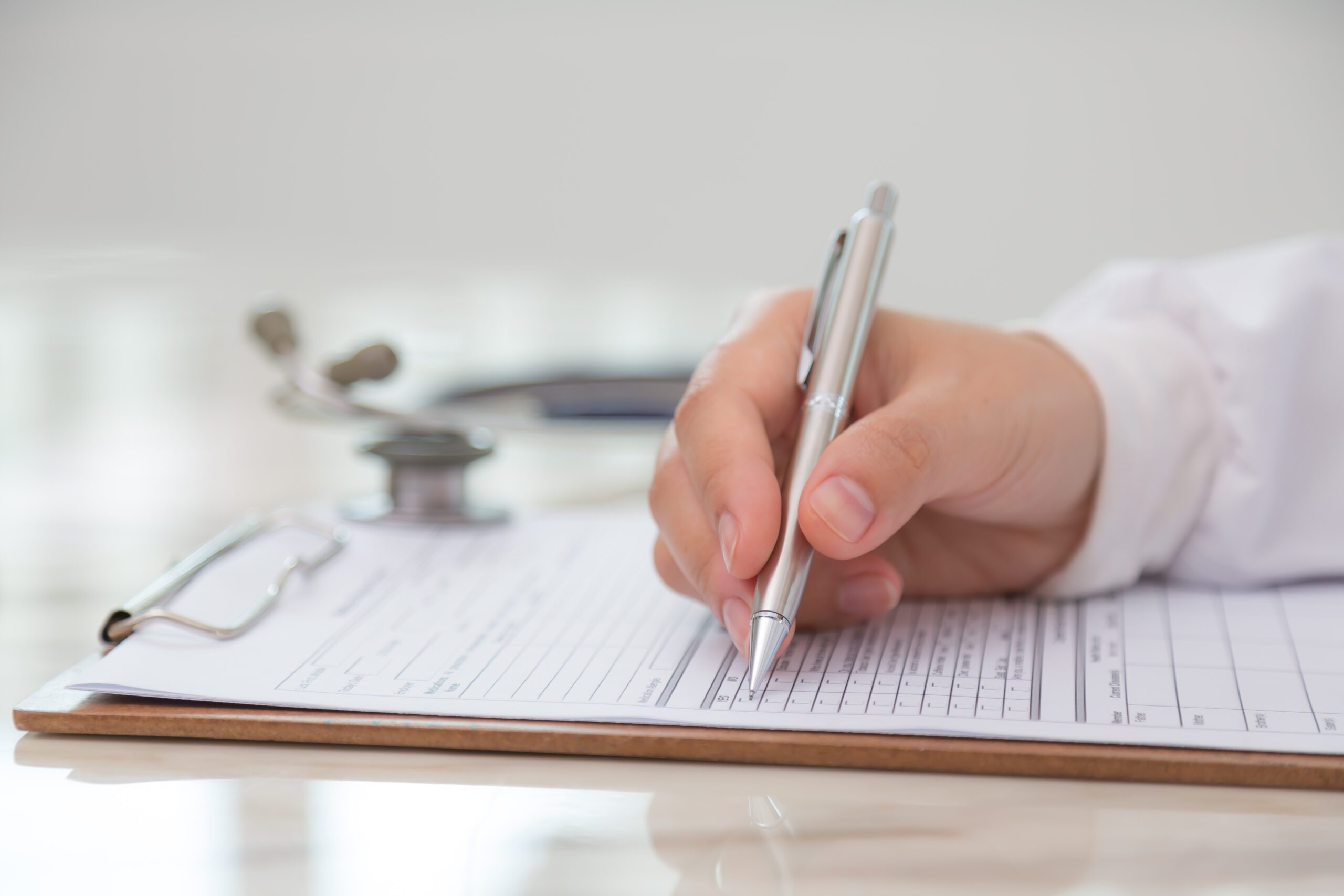 Veterinarian reviewing relief vet contract clauses, focusing on payment terms, liability insurance, and job responsibilities to ensure fair compensation and legal protections.